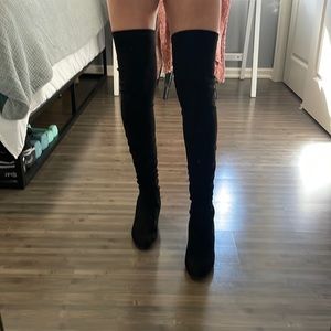 Thigh high heeled boots